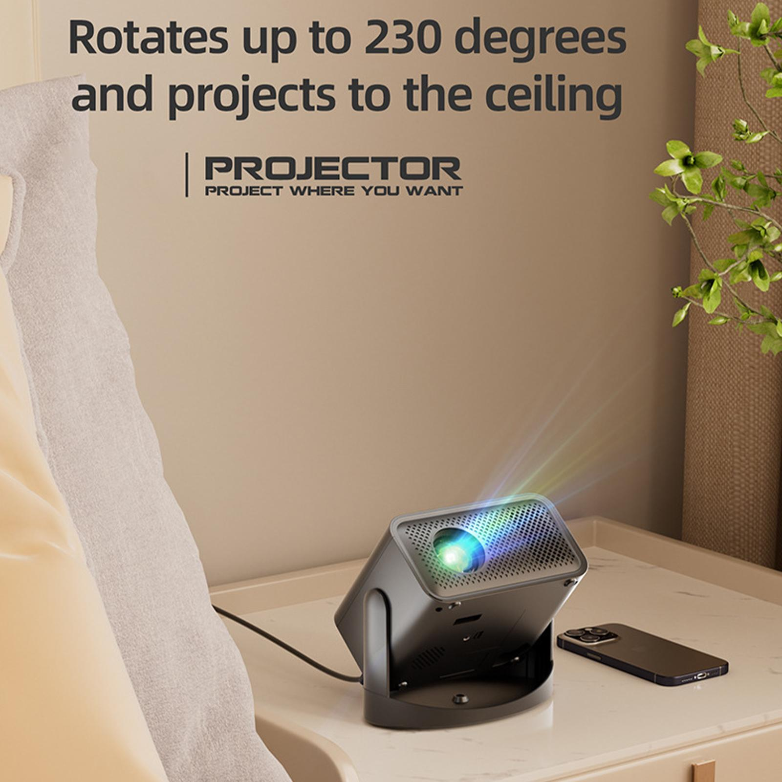Projektor auf einem Tisch, der ein farbenfrohes Bild projiziert, mit einem Telefon.