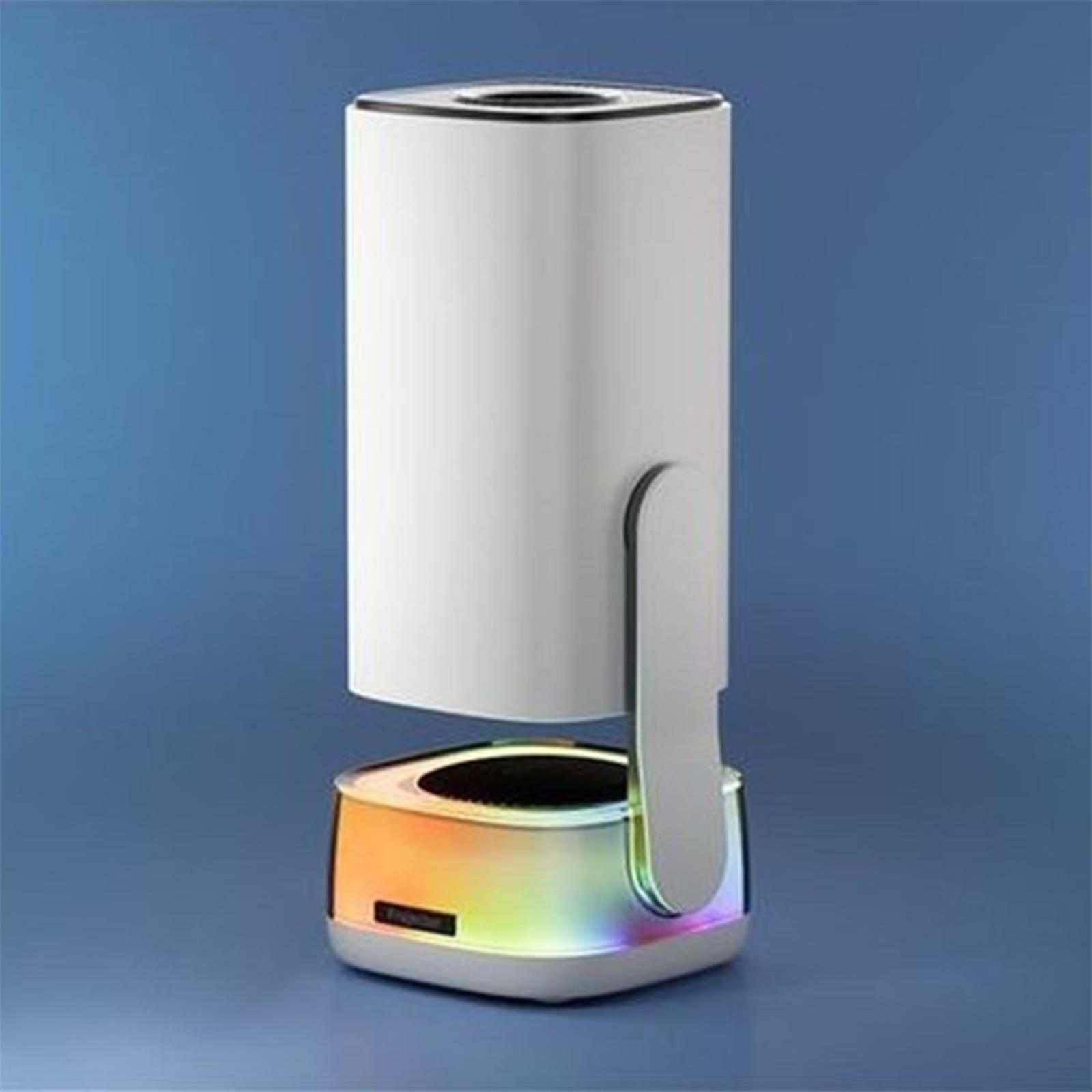 Weiße Lampe mit farbenfrohem Sockel und Griff. Sie steht auf blauem Hintergrund.