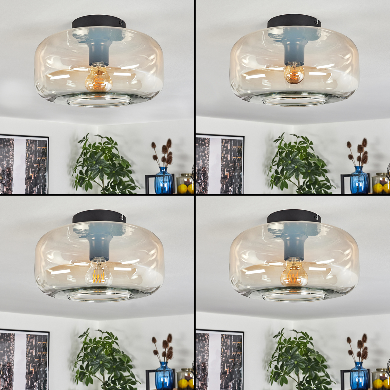 Vier Deckenlampen mit bernsteinfarbenen Glasschirmen. Die Lampen befinden sich an einer weißen Decke, im Hintergrund sind Pflanzen.