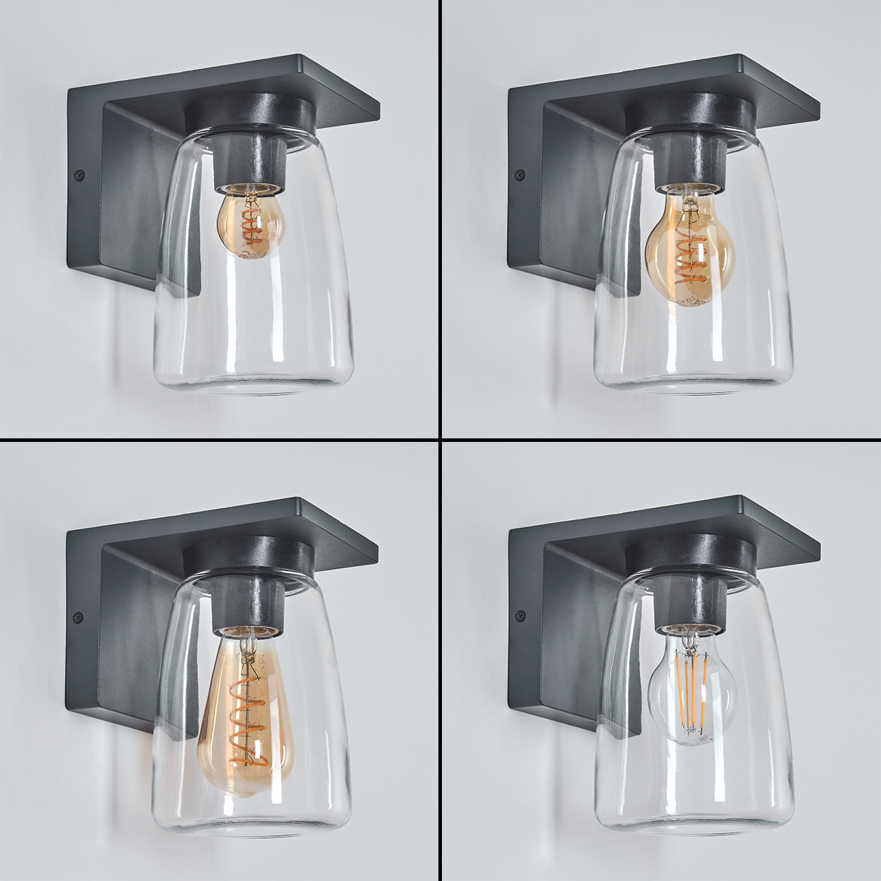 Vier Wandlampen mit Glasschirmen und sichtbaren Glühbirnen, angeordnet an einer weißen Wand.