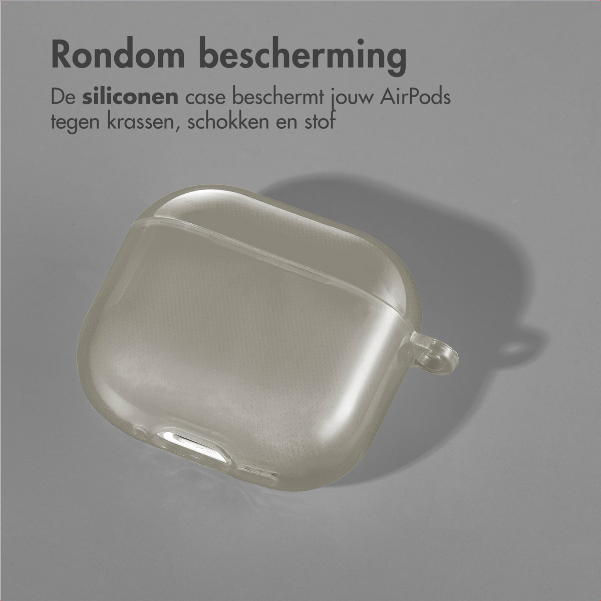 Grey AirPod case, on a grey background, with text in Dutch.