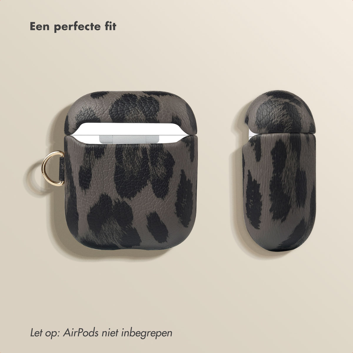 Leopard print AirPods case open. Gold ring. Beige background.