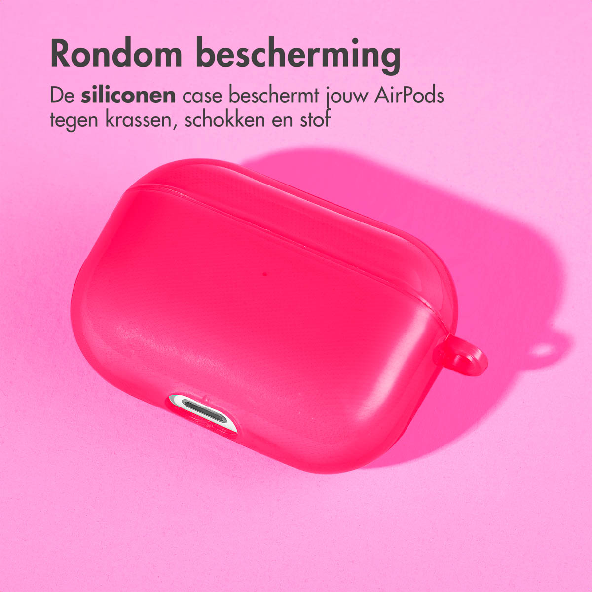Pink AirPods case, on a pink background. The case is closed.