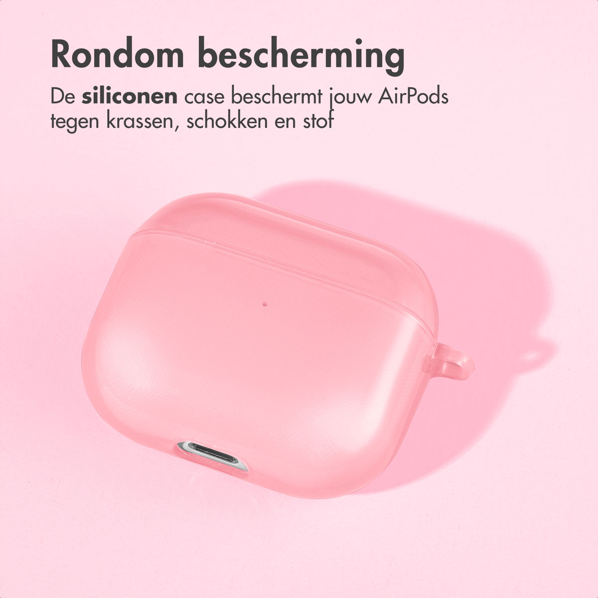 Pink AirPods case on a surface with a shadow. Text is present above the case.