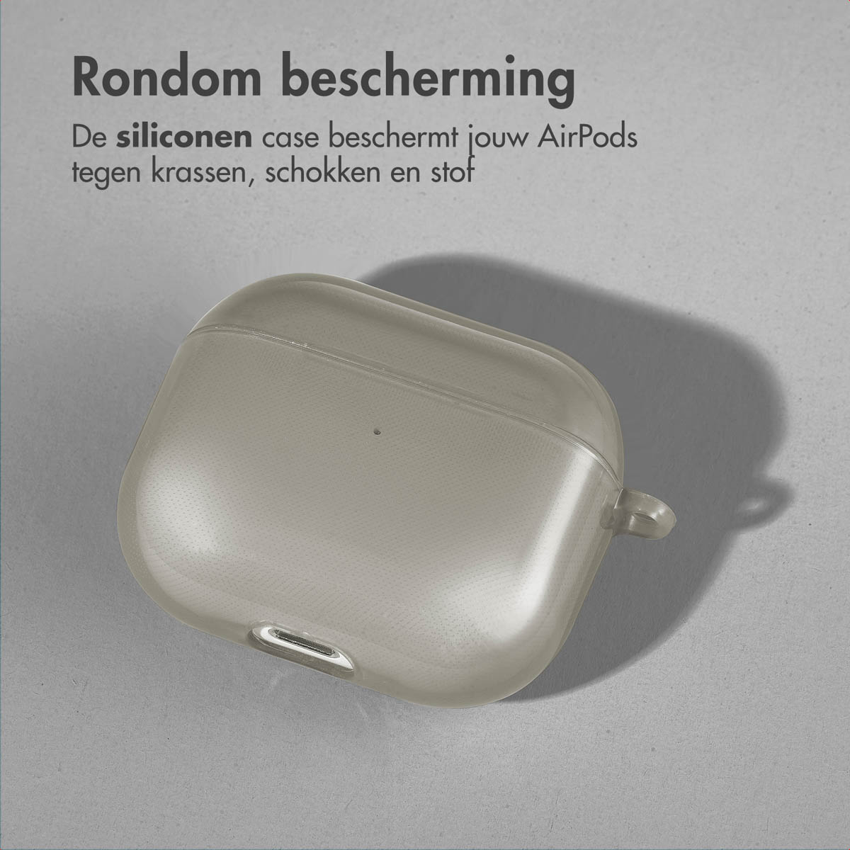 A light gray AirPods case on a gray surface. Text: All-around protection.