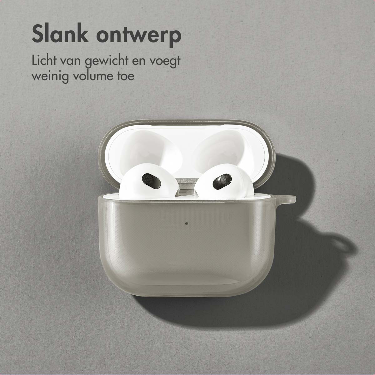 Gray AirPods case with white AirPods inside, on a gray surface. Text: Slim design.