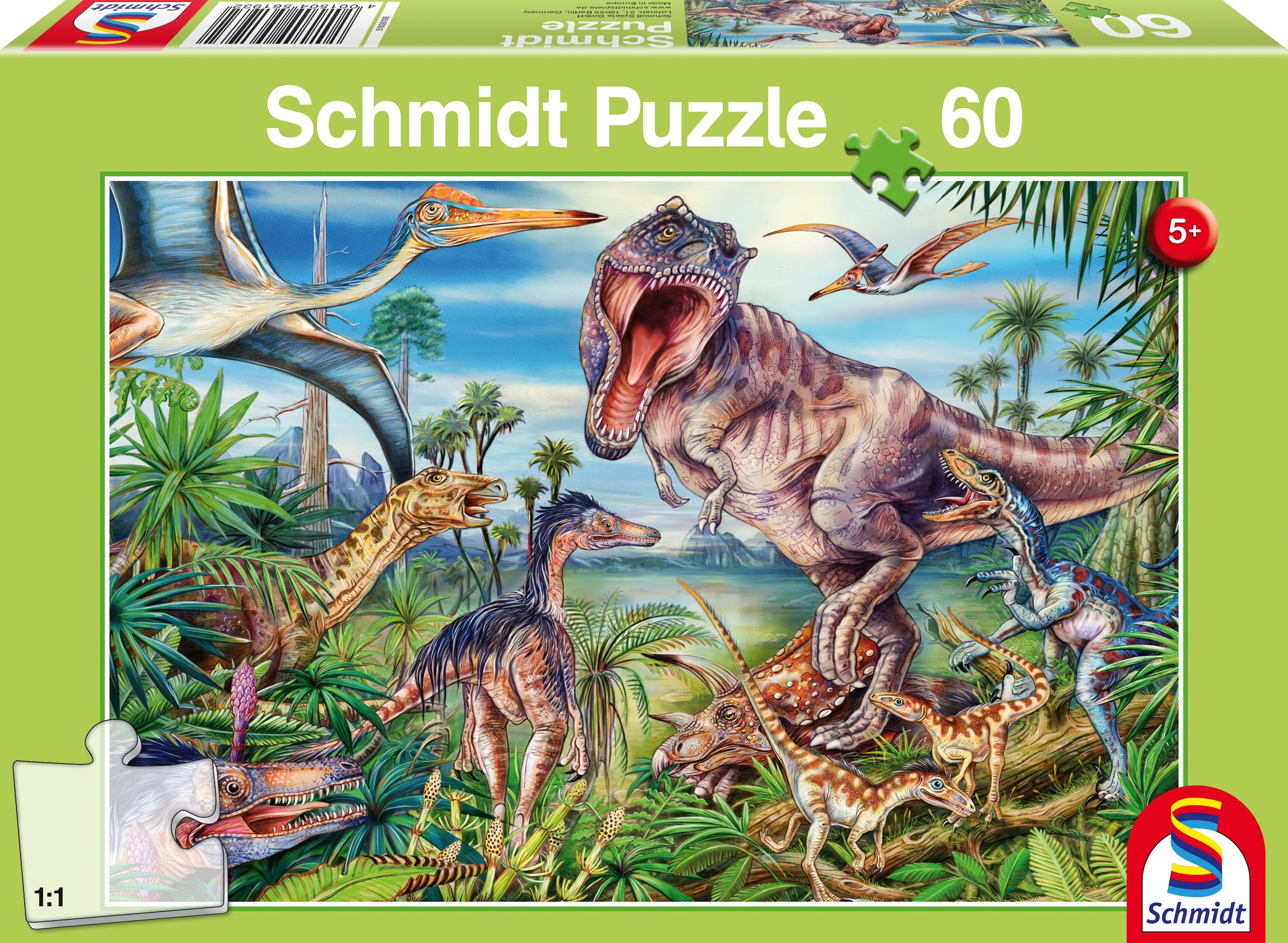 Pudełko Schmidt Puzzle przedstawia scenę z dinozaurami z różnymi prehistorycznymi stworzeniami w dżungli.