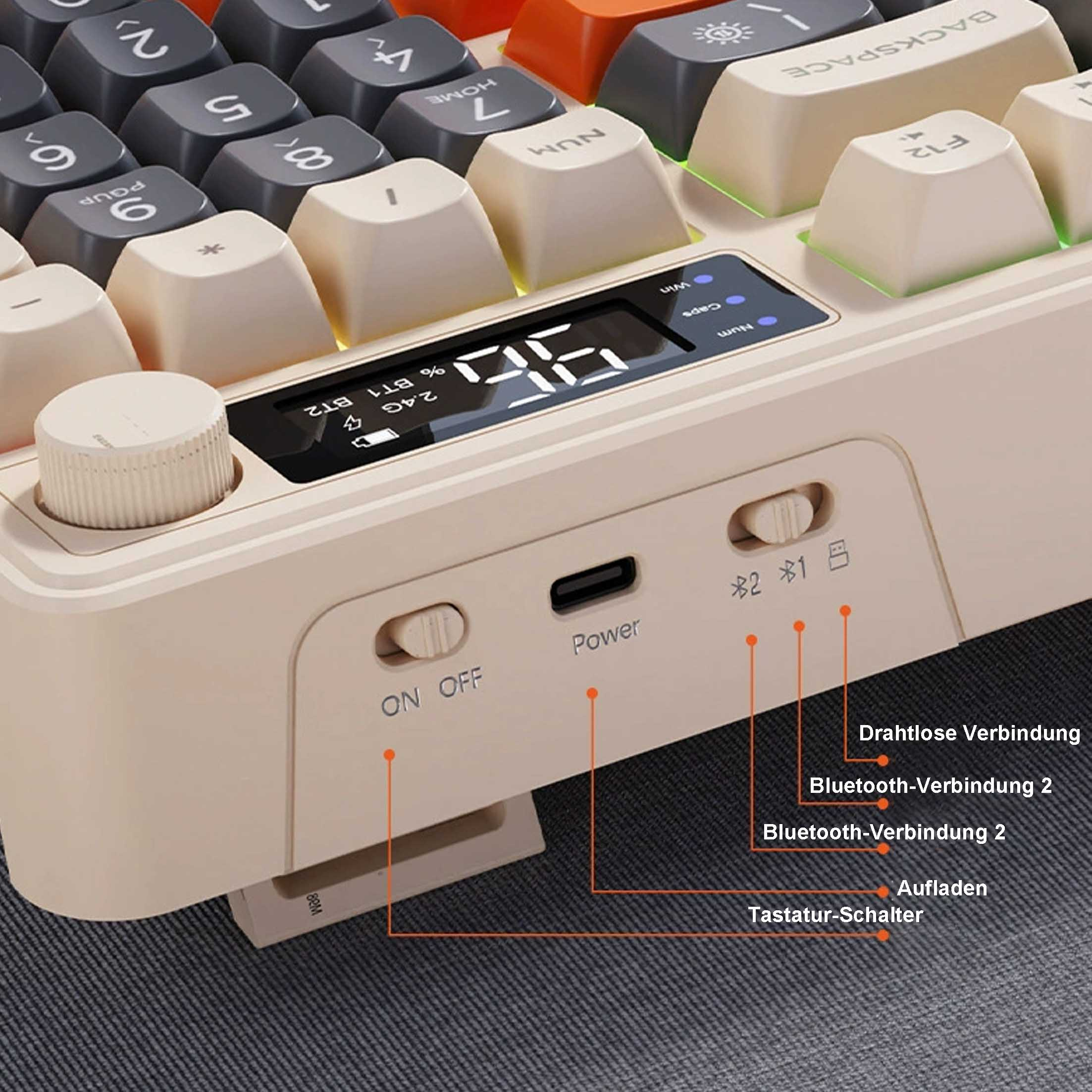 Zbliżenie beżowej klawiatury mechanicznej z pomarańczowymi klawiszami i małym wyświetlaczem.