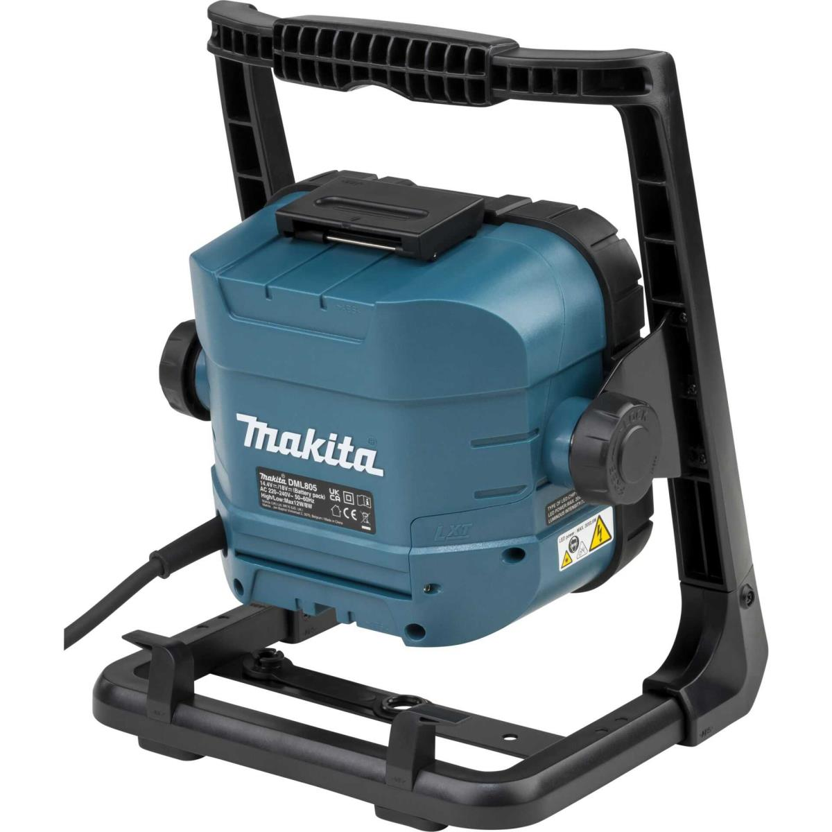 Foco de trabajo Makita en un marco negro. Es azul y negro, con asa y etiqueta de advertencia.