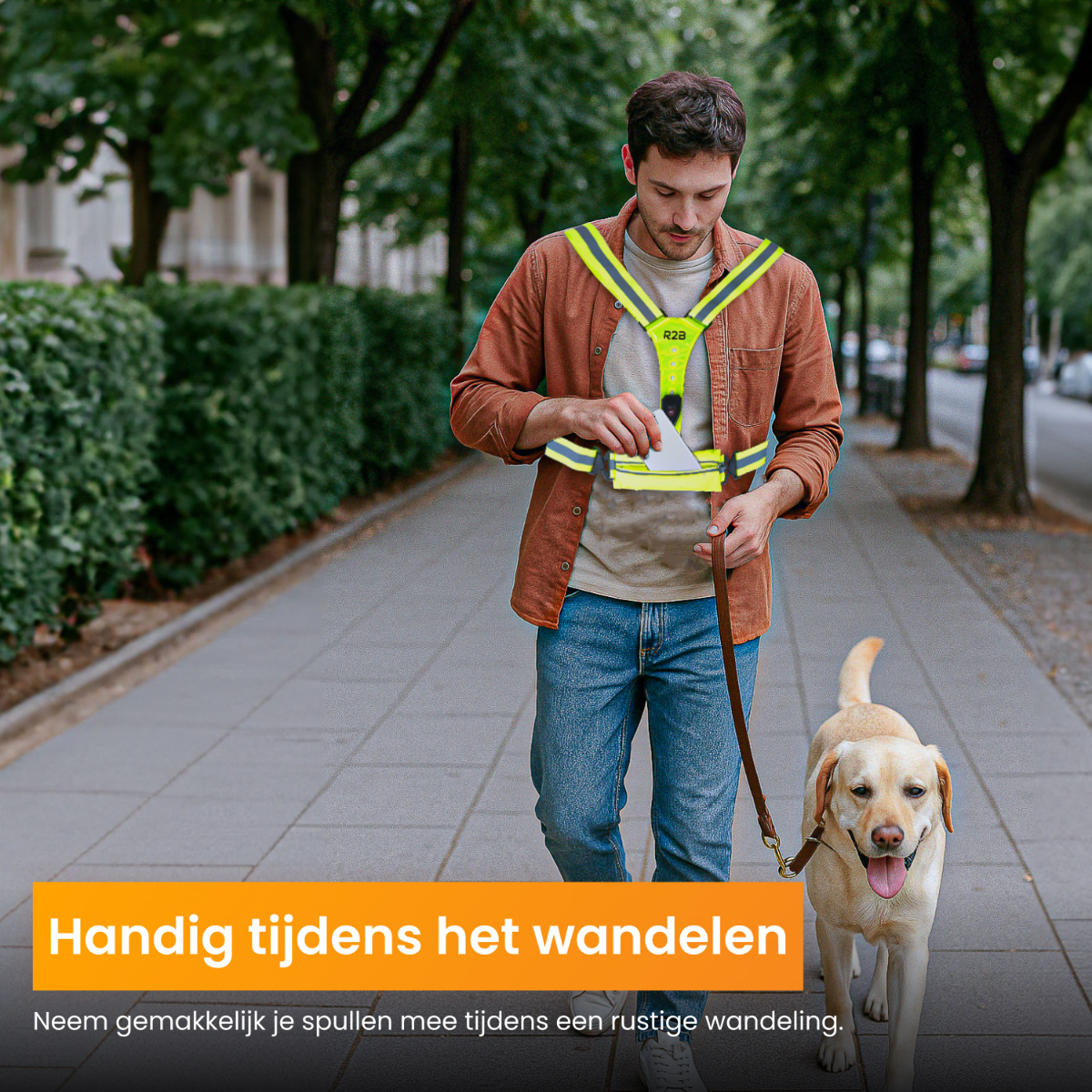 Man walking a dog, wearing a reflective vest with a phone pocket, on a city street.