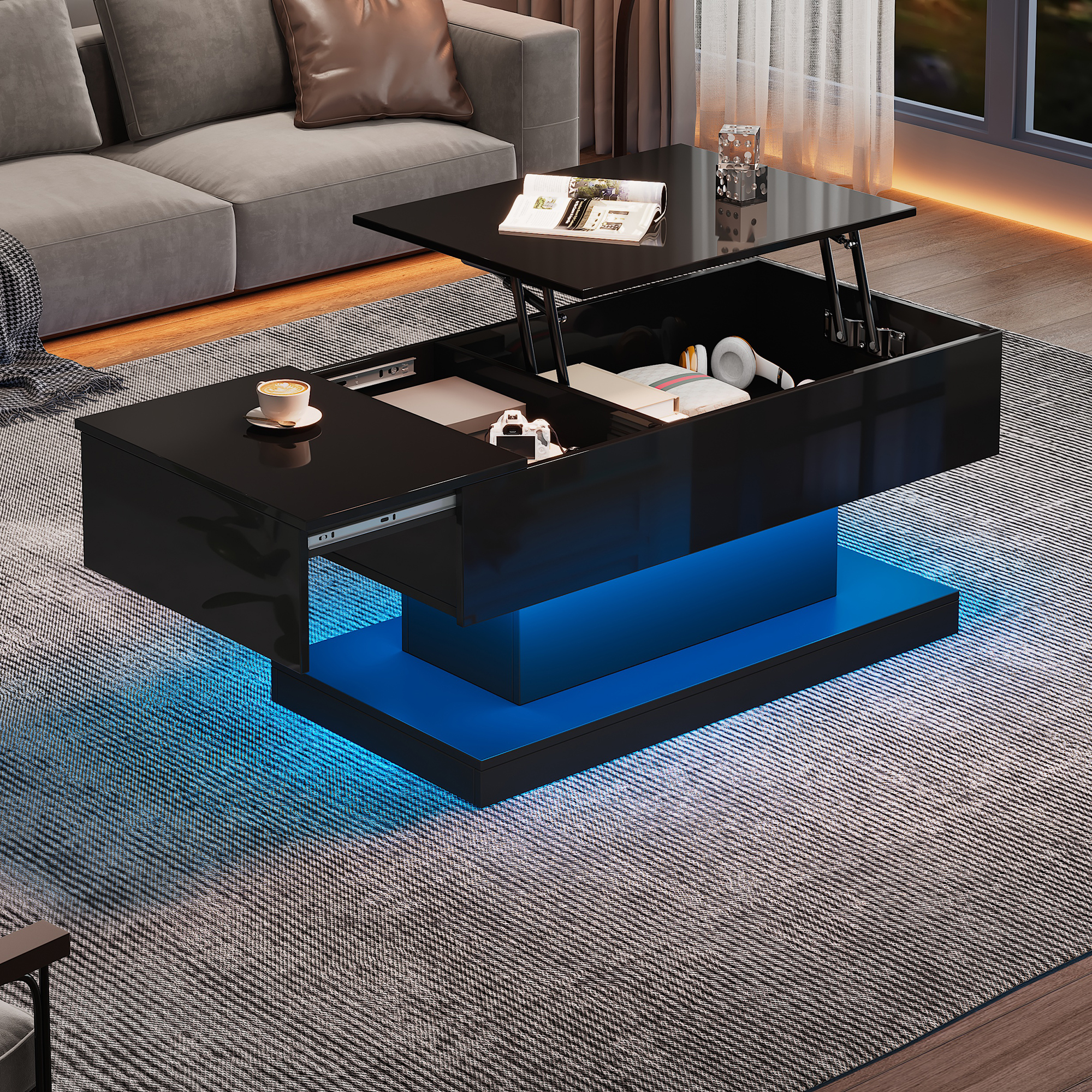 Schwarzer Couchtisch mit Hebevorrichtung und blauen LED-Leuchten. Bücher, Tasse und Kopfhörer sichtbar.