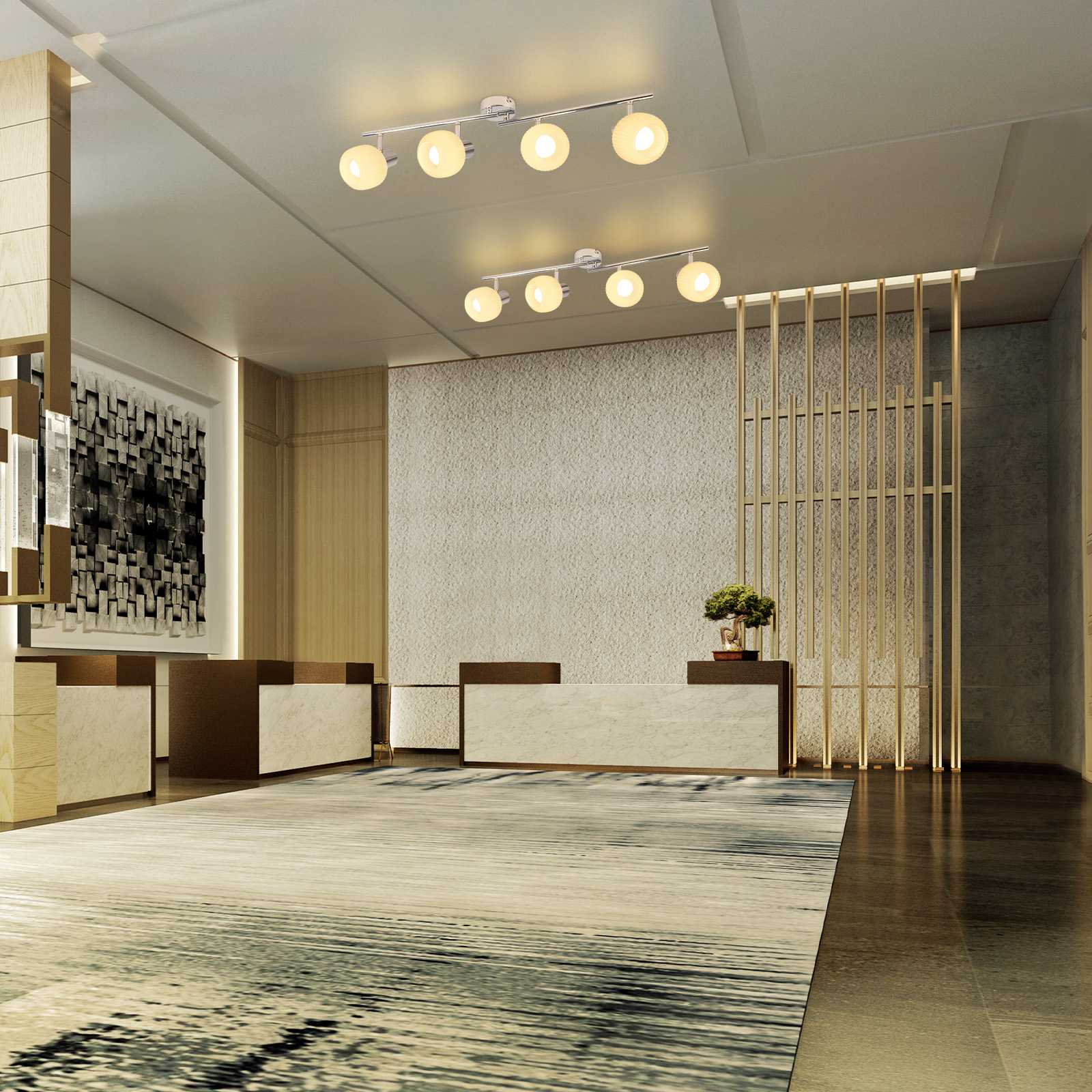 Una hall moderna con lampadari. Un lungo tappeto e reception con piano in marmo in primo piano.