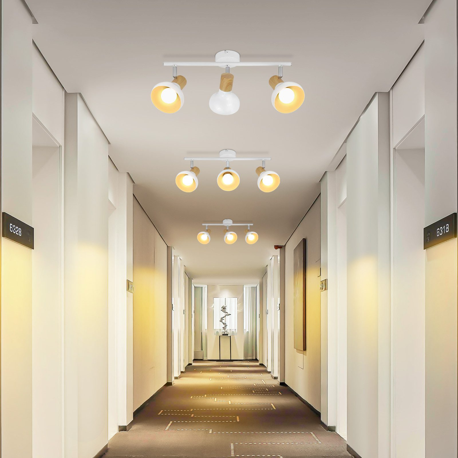 Corridoio con luci a soffitto. Pareti bianche, porte e luci con dettagli in legno. Tappeto scuro.