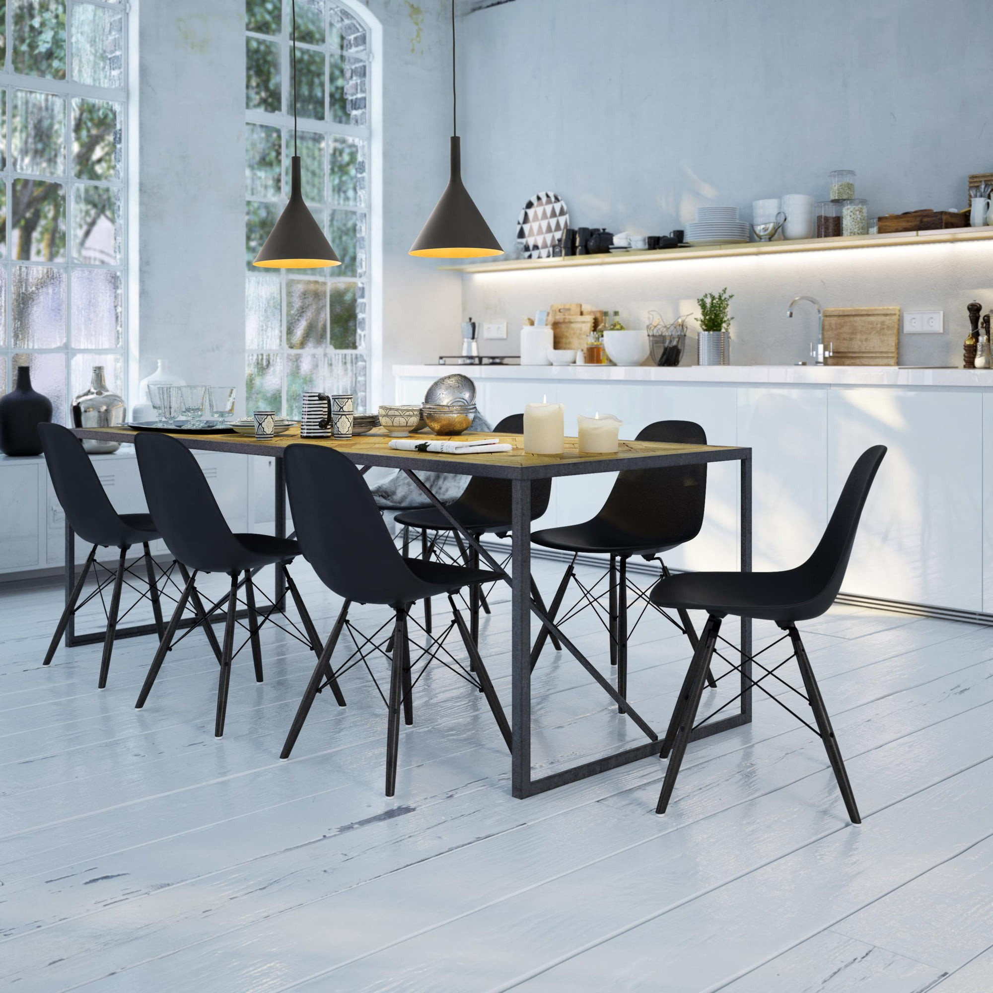 Sala da pranzo con tavolo in legno, sedie nere e lampade a sospensione. Cucina e finestre sullo sfondo.