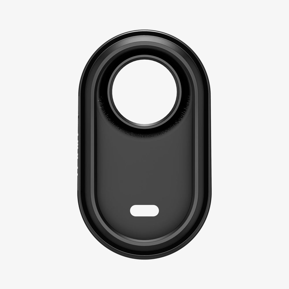 Czarny owalny obiekt z centralnym otworem. Ma białe tło i napis 'Galaxy SmartTag'.