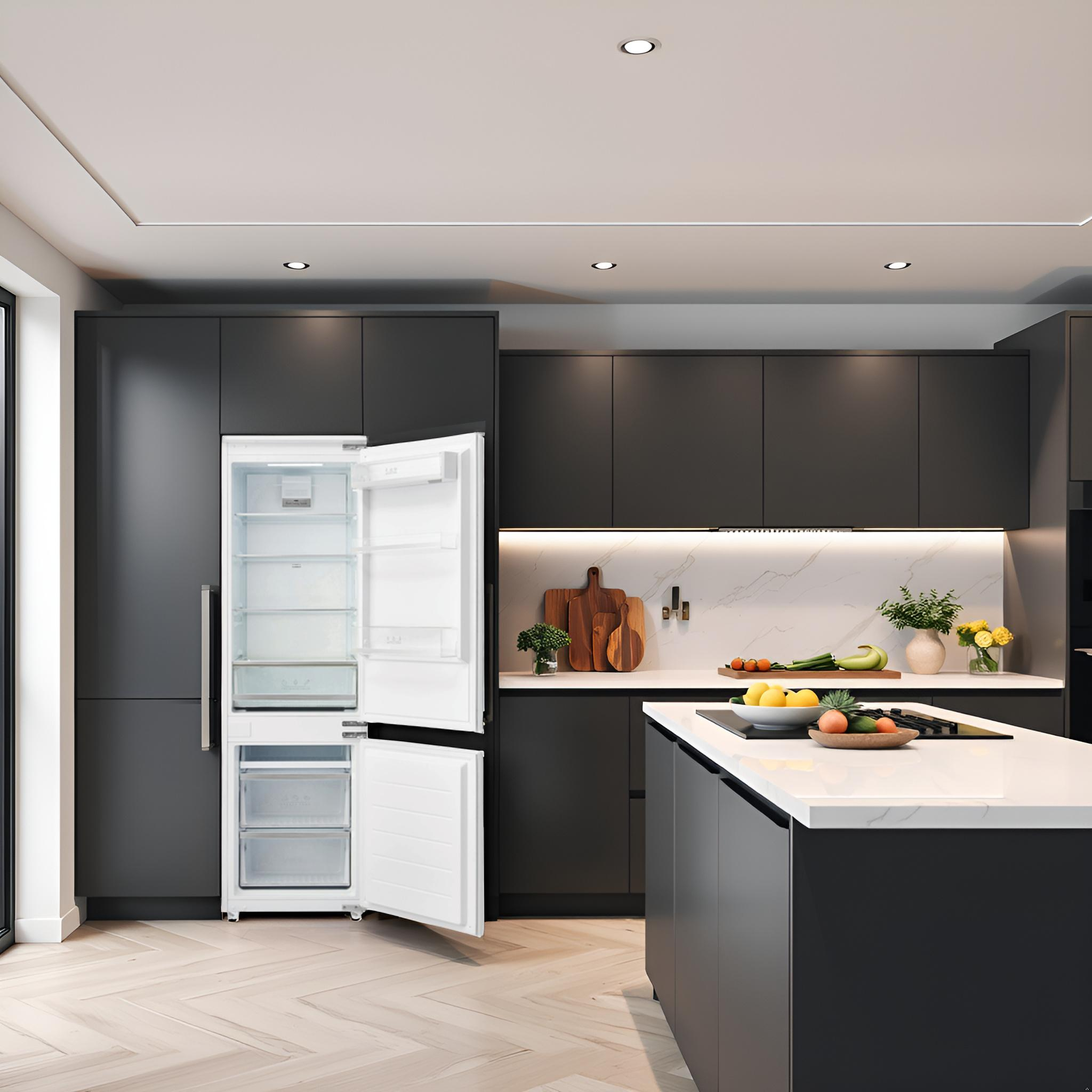Cocina moderna con refrigerador blanco abierto. Gabinetes grises, isla y salpicadero de mármol.