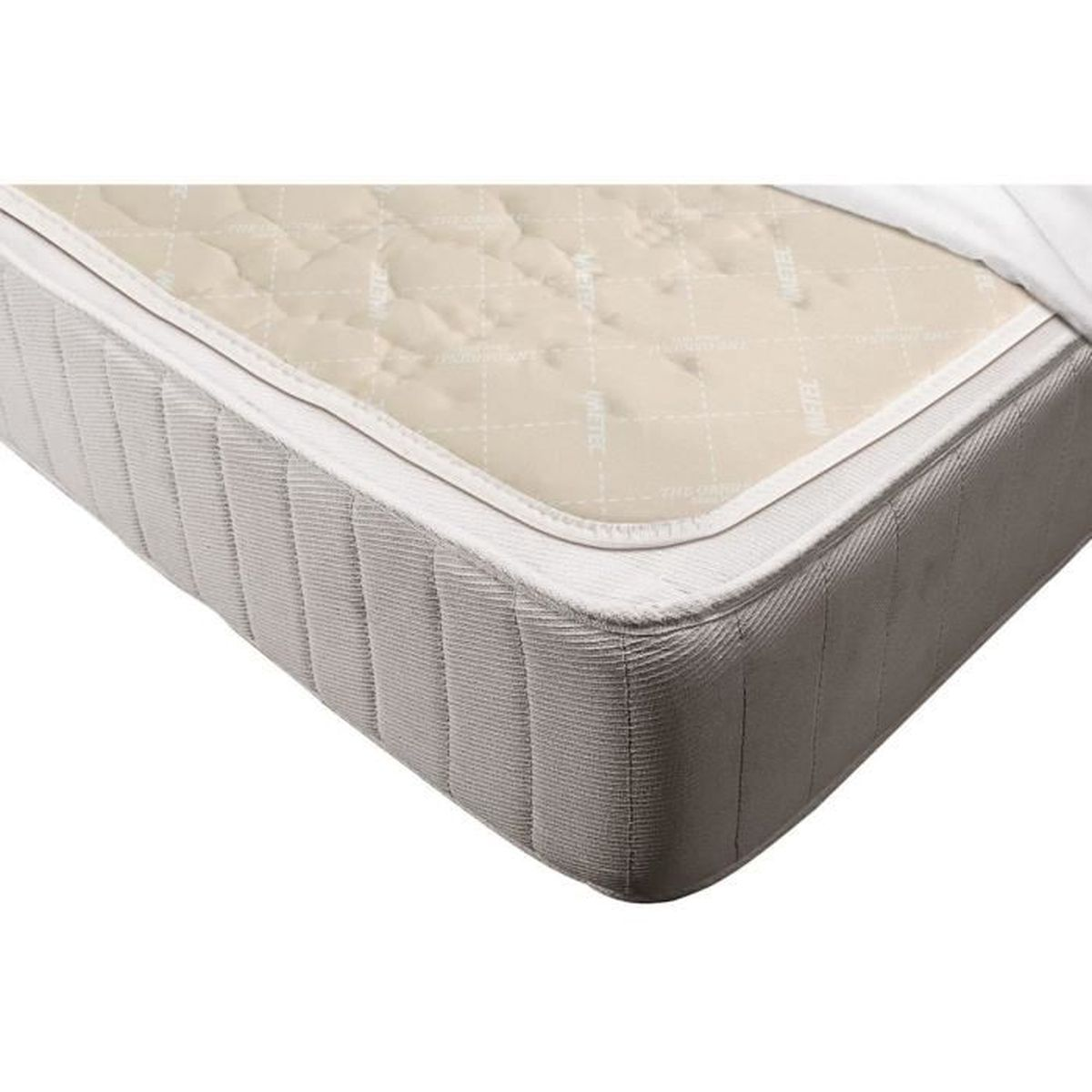 Un materasso beige con bordo bianco e il marchio Vertage. È un primo piano.