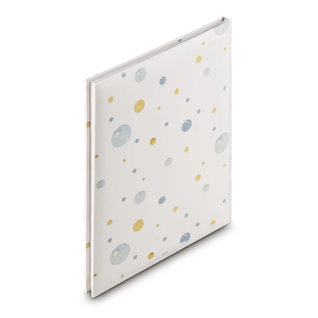 Biała okładka z niebieskimi i żółtymi kropkami. Widok z boku.