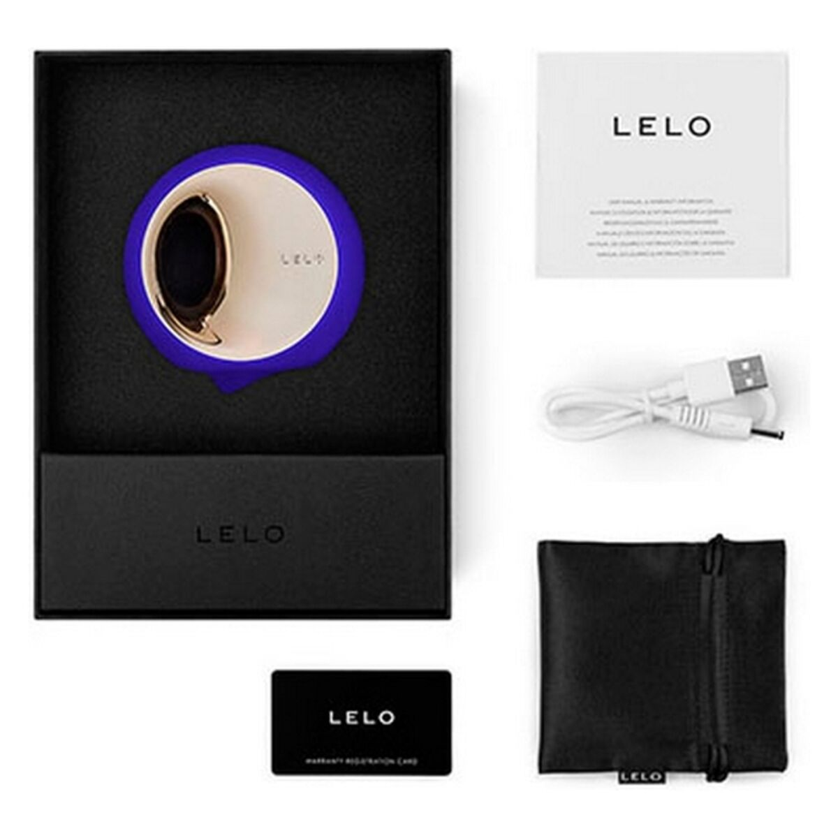 Un juguete sexual azul y dorado en una caja negra con accesorios sobre fondo blanco.