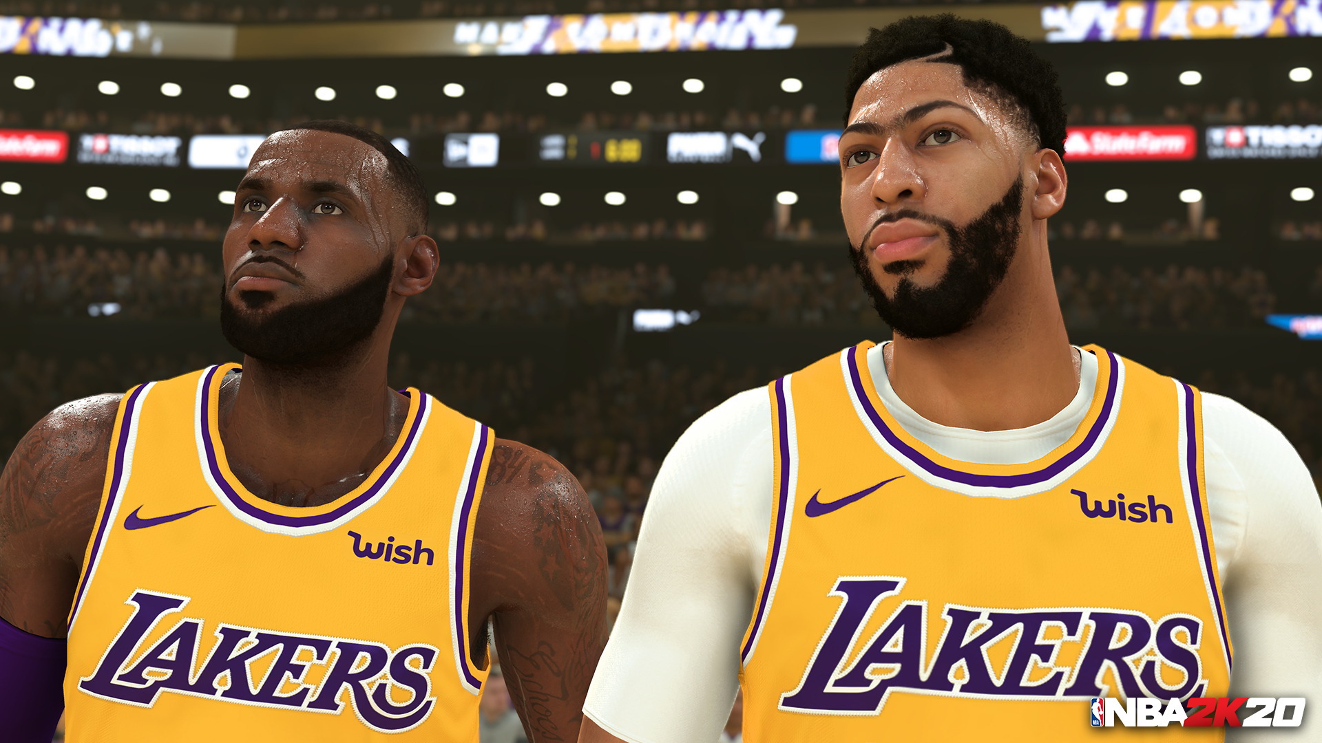 Due giocatori di basket, LeBron James e Anthony Davis, in uniforme Lakers, che guardano in alto.