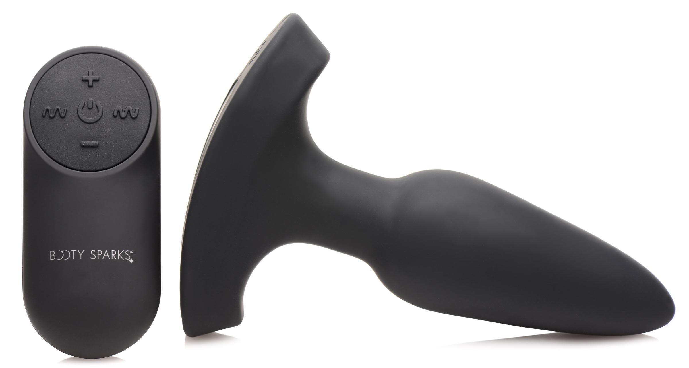 Czarna zabawka erotyczna i pilot. Zabawka ma kształt uchwytu. Pilot ma przyciski.