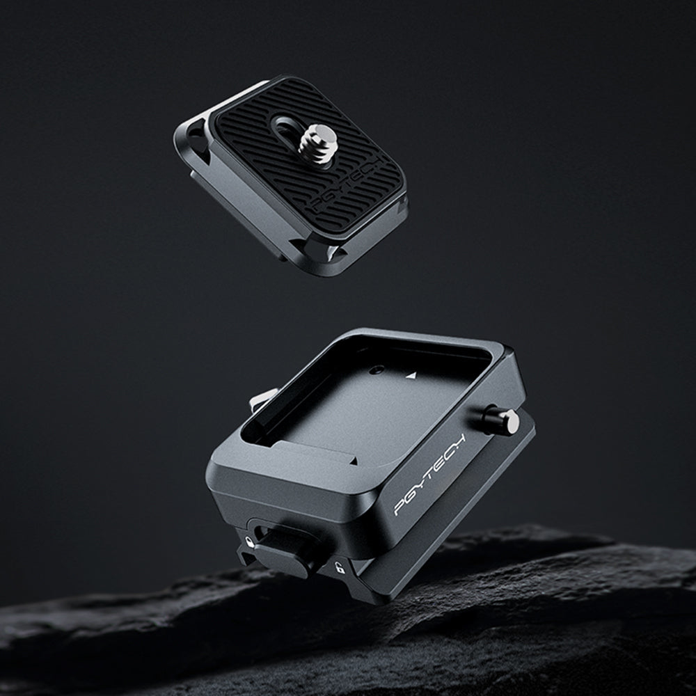 Czarny dodatek do aparatu, płytka szybkiego uwalniania, na kamiennej powierzchni.