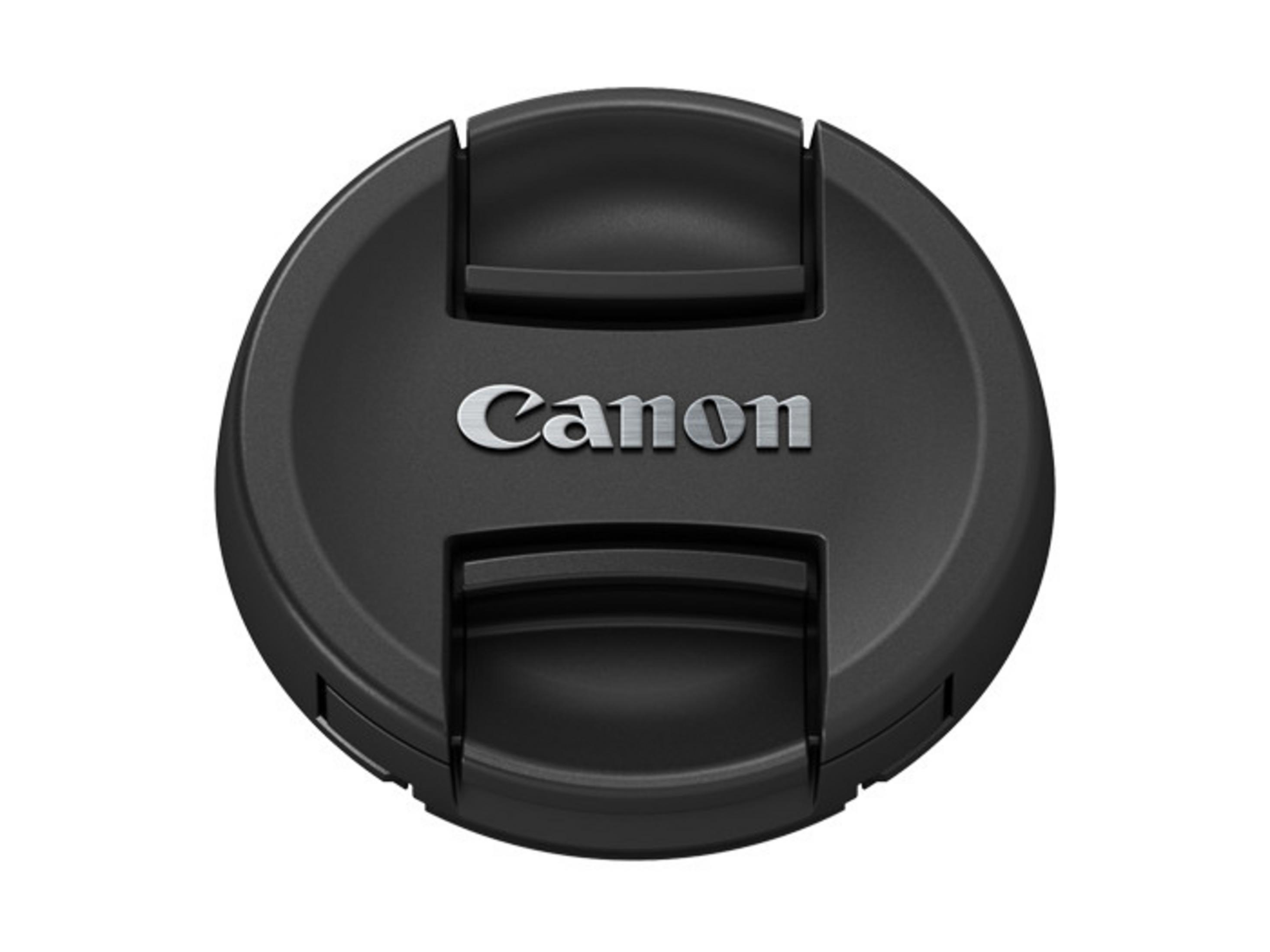 Czarny dekielek Canon z logo Canon w srebrnym kolorze. Okrągły kształt, białe tło.