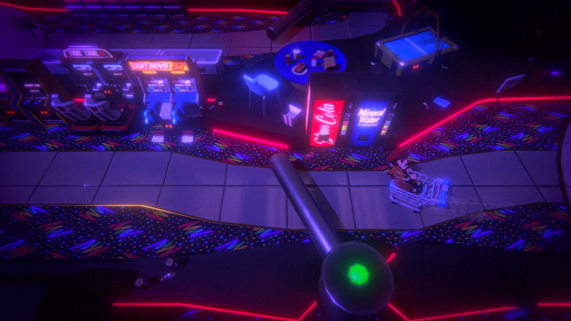 Widok z góry na salon gier. Wózek sklepowy jest pchany w dół pasa.