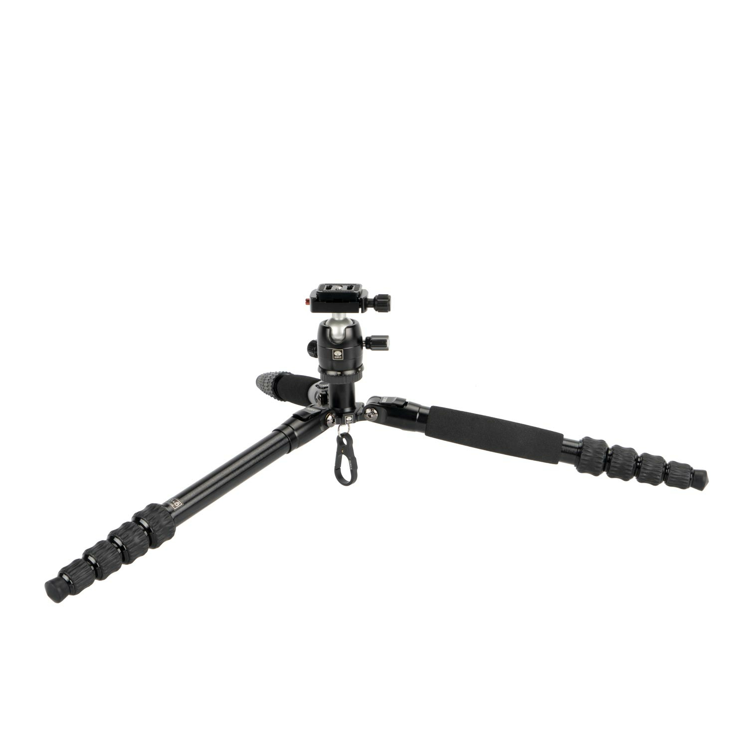 A black tripod with three legs, a ball head, and a mounting plate. Stands on a white surface.