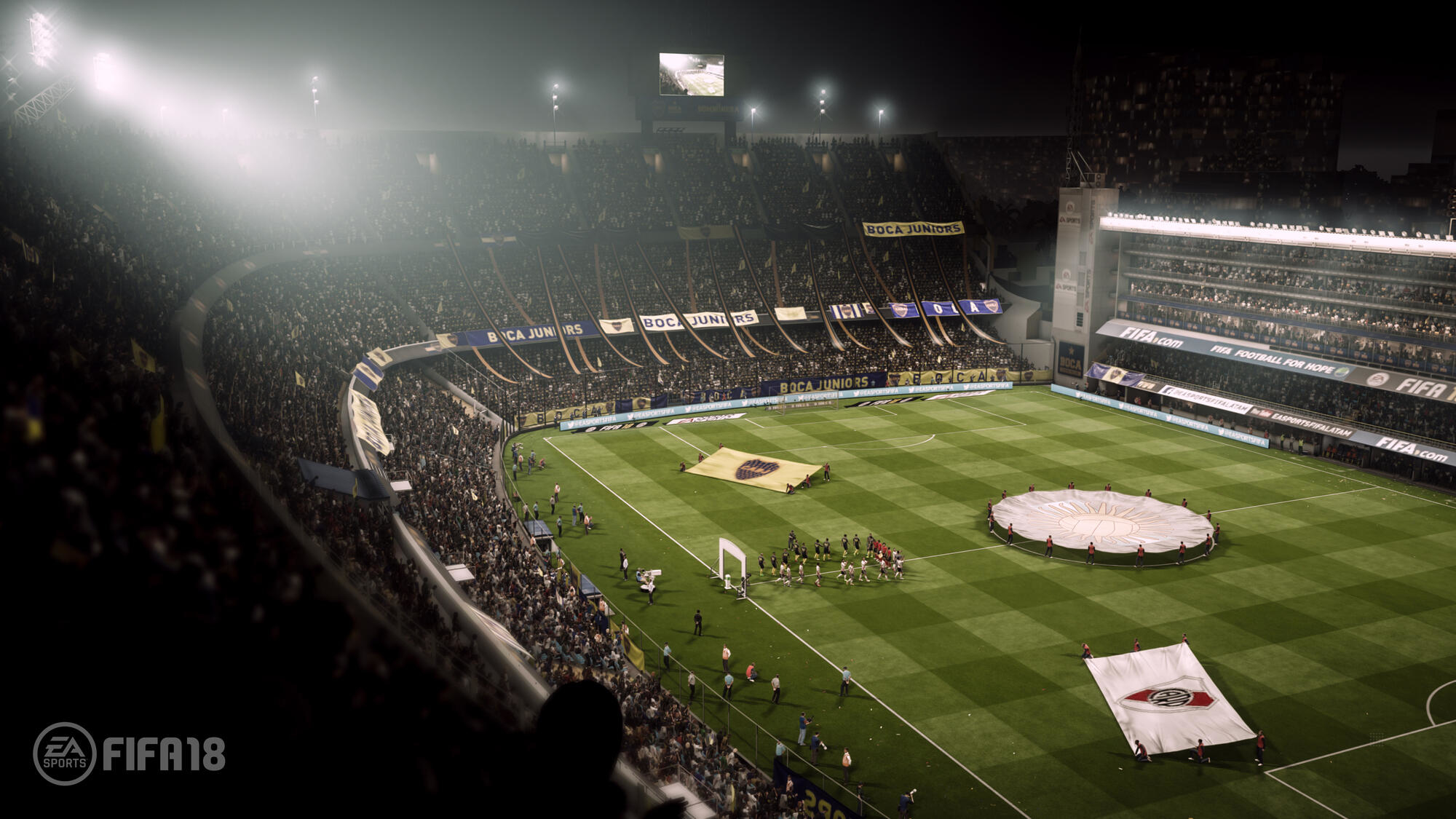 Nachtansicht eines überfüllten Stadions während eines Fußballspiels, mit Lichtern und Bannern.