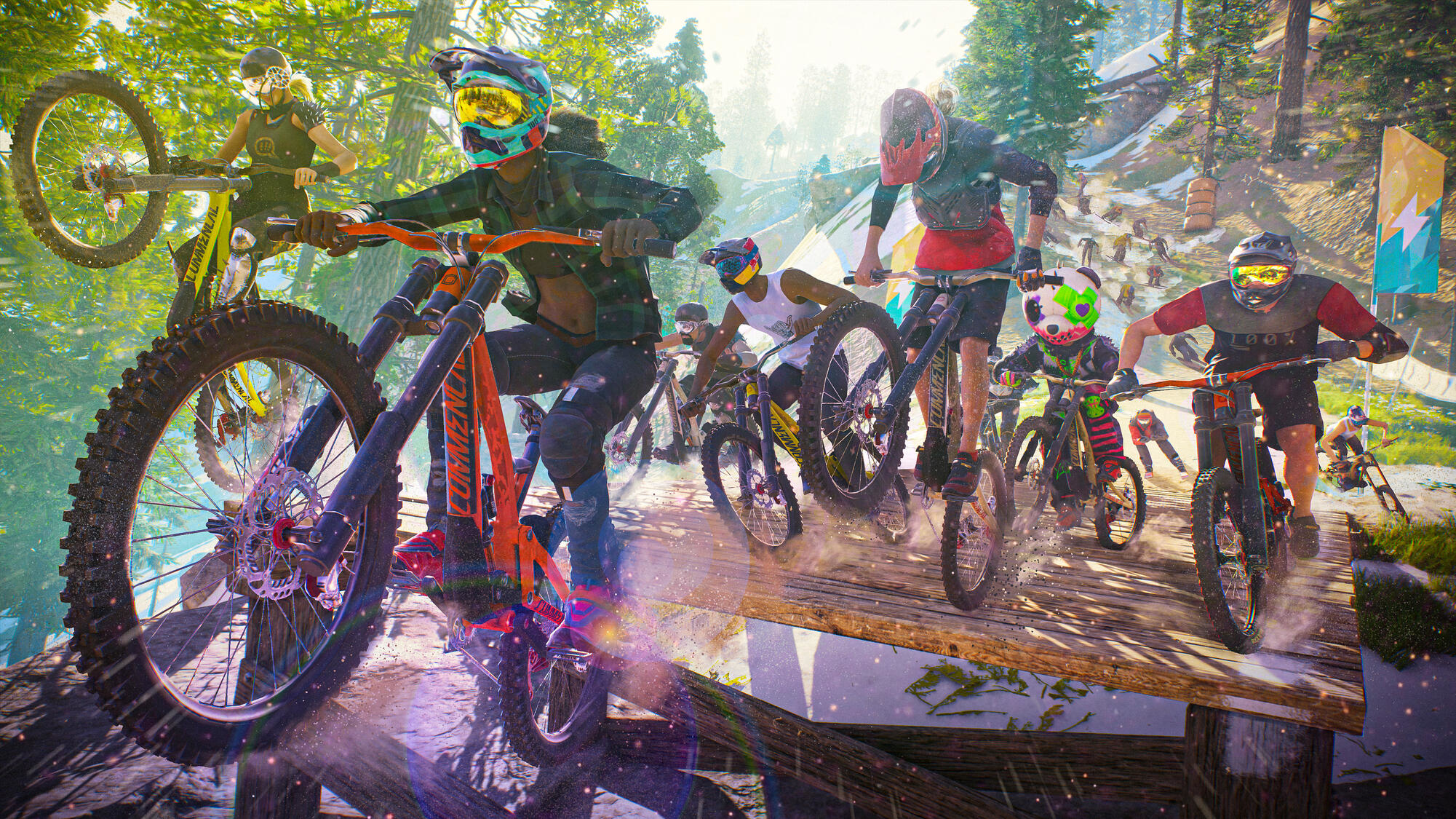 Diversi biker guidano mountain bike su una rampa di legno.