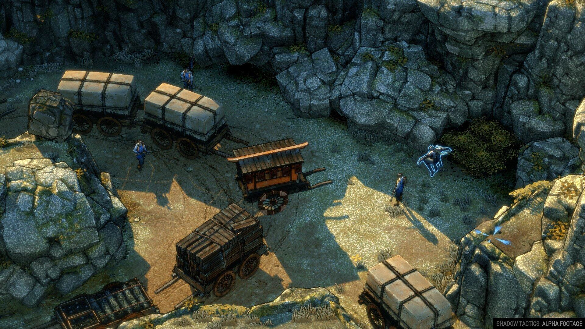 Una vista dall'alto di una scena di gioco con carri e persone.