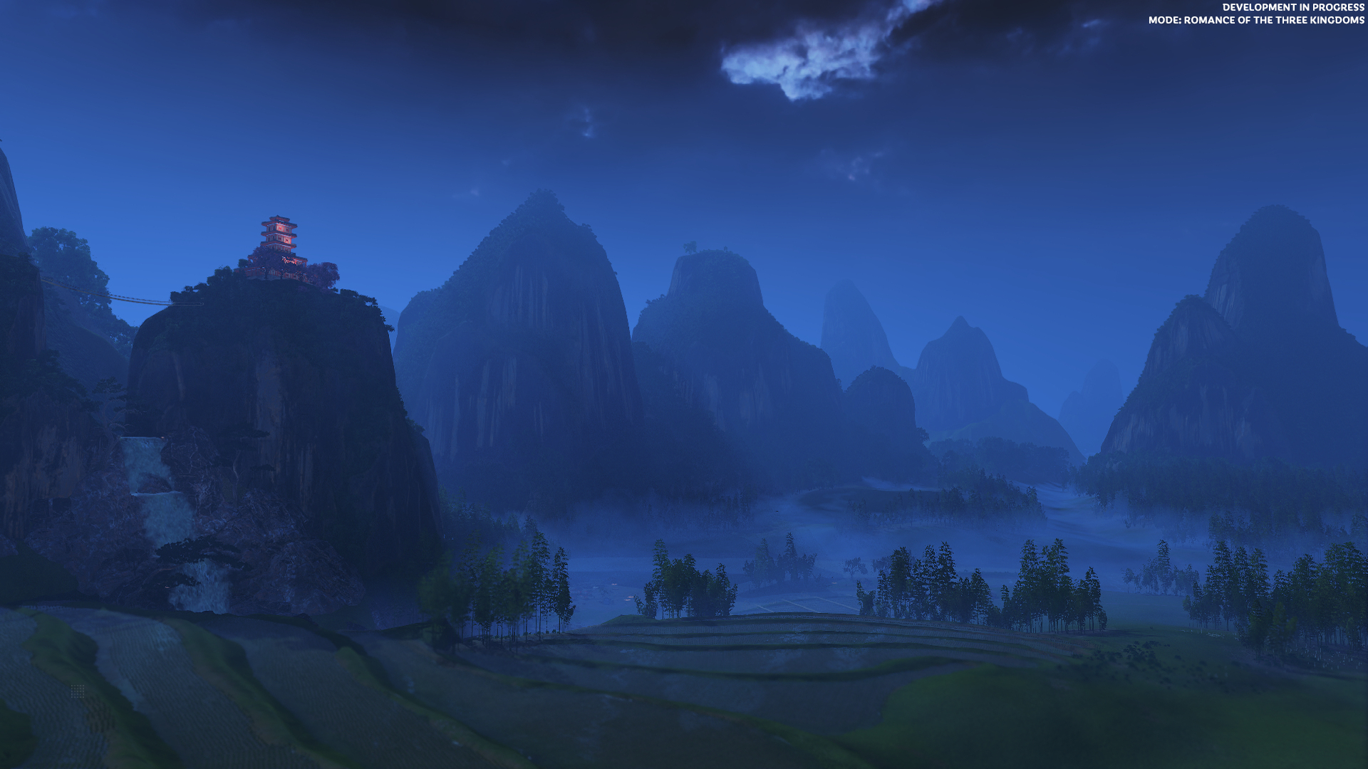 Nocny krajobraz z górami, polami ryżowymi i budynkiem na wzgórzu pod zachmurzonym niebem.