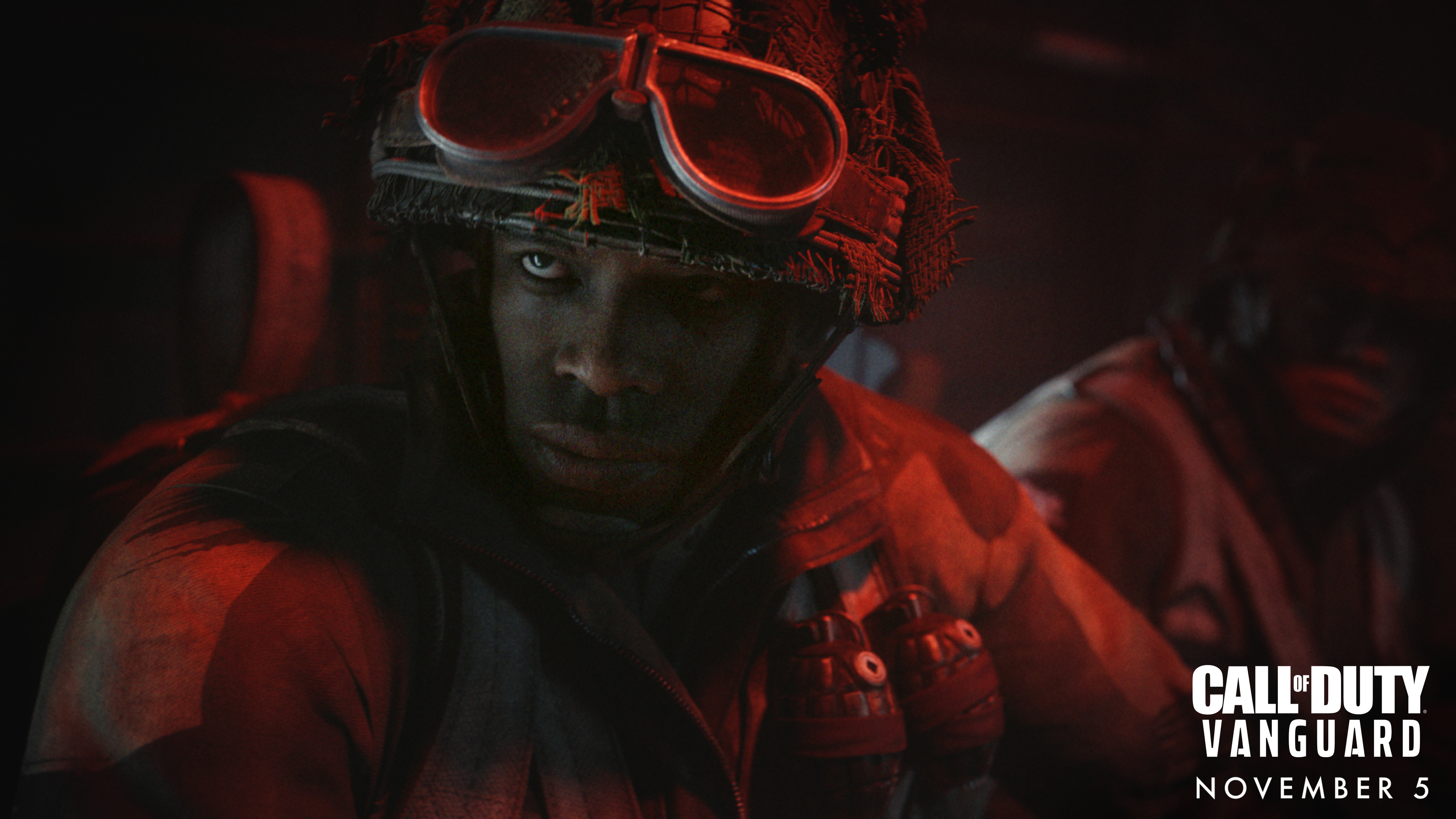 Soldato con elmetto e occhiali, in un ambiente buio, con il logo Call of Duty.