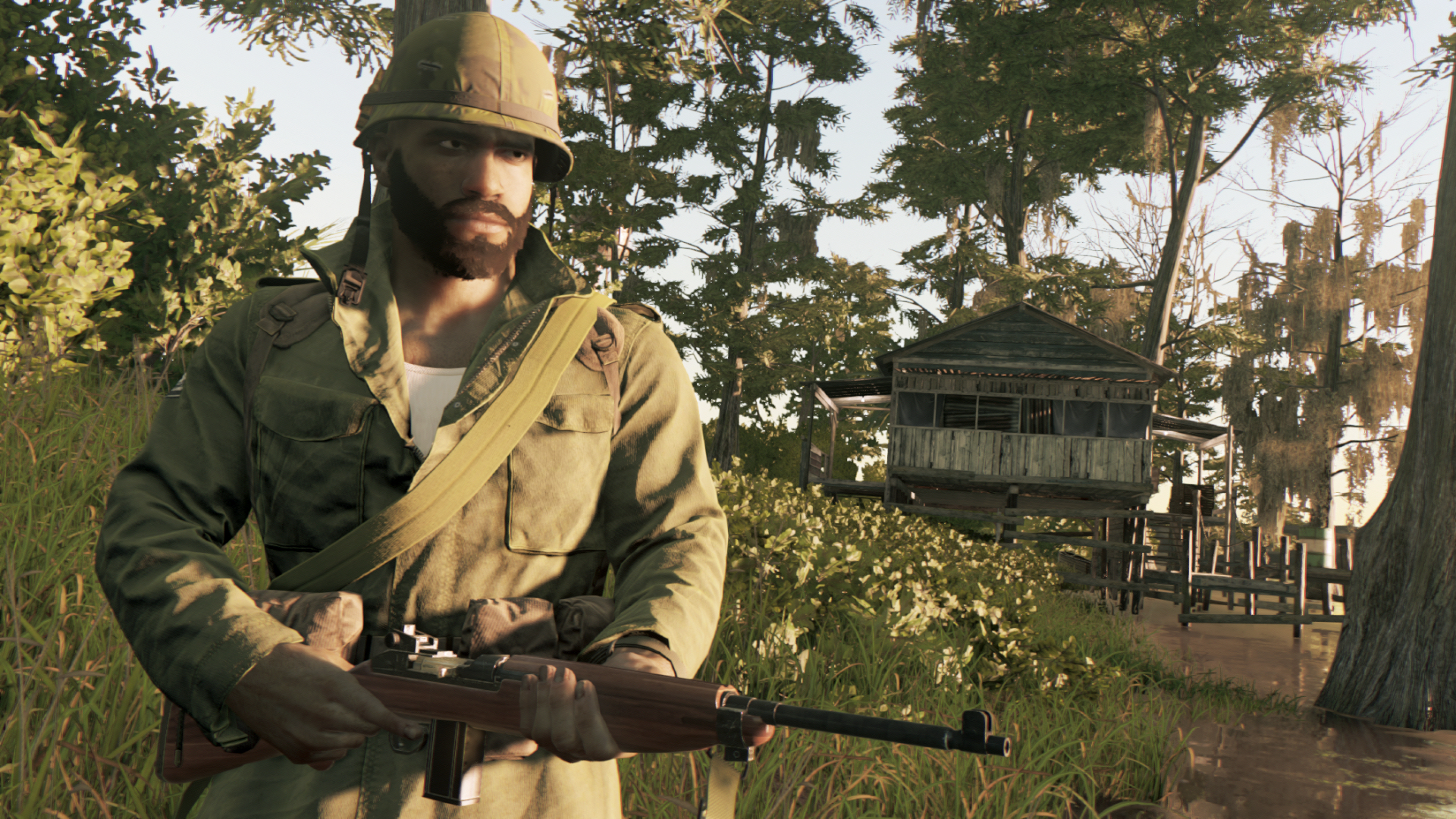 Mężczyzna w mundurze wojskowym trzymający karabin. Tło obejmuje mały drewniany budynek.
