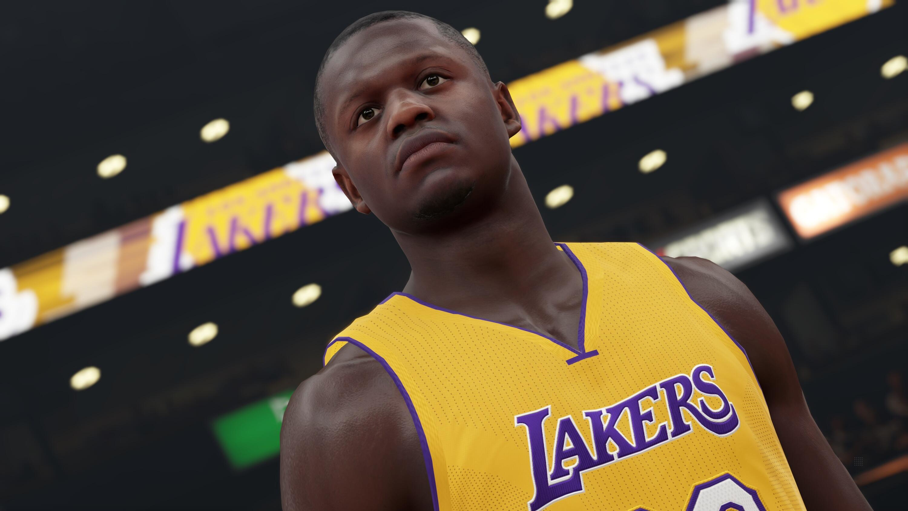 Un giocatore di basket con una maglia gialla con 'LAKERS' guarda in alto, luci dell'arena sullo sfondo.