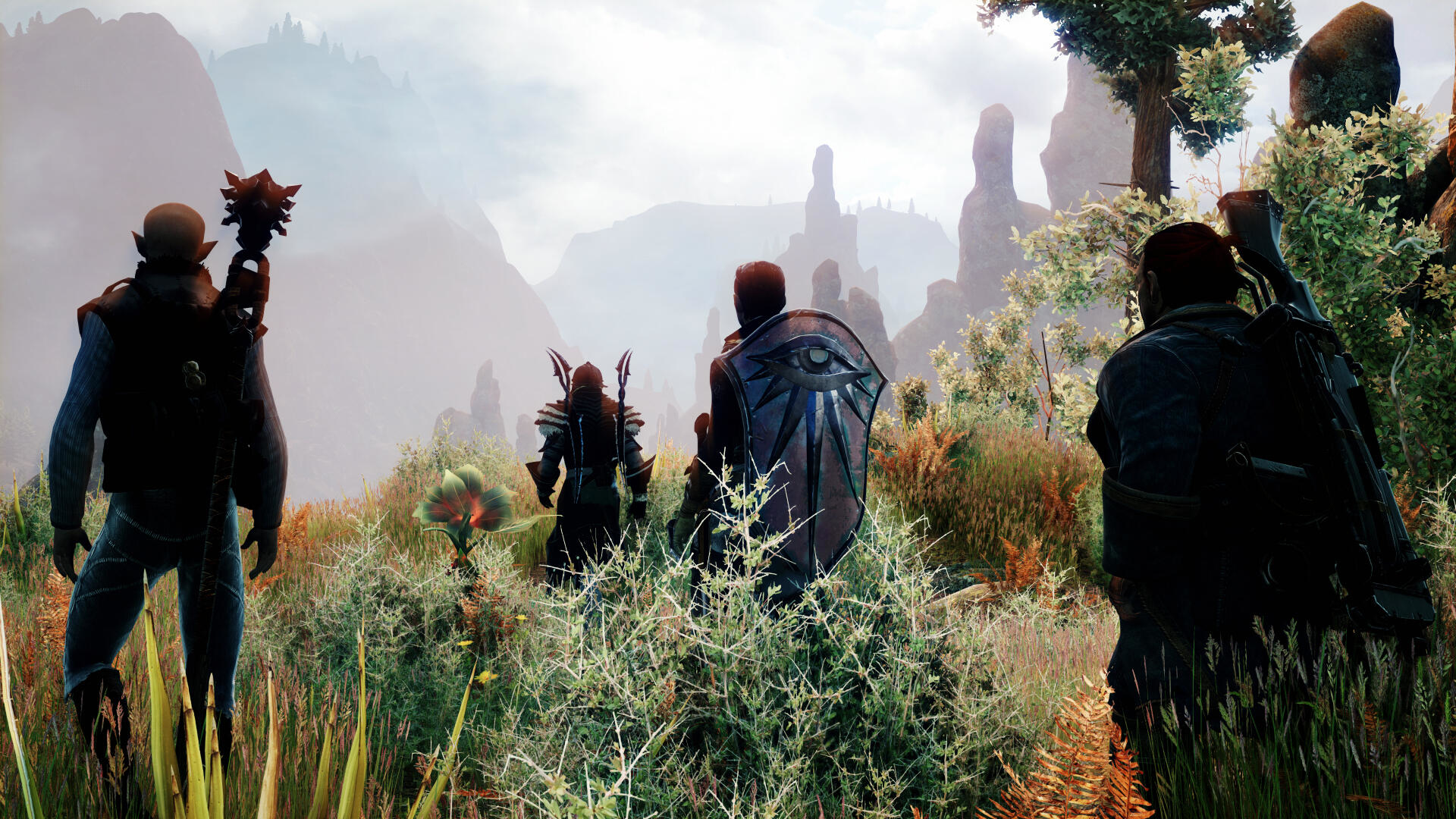 Scena z Dragon Age: Inquisition z postaciami w krajobrazie.