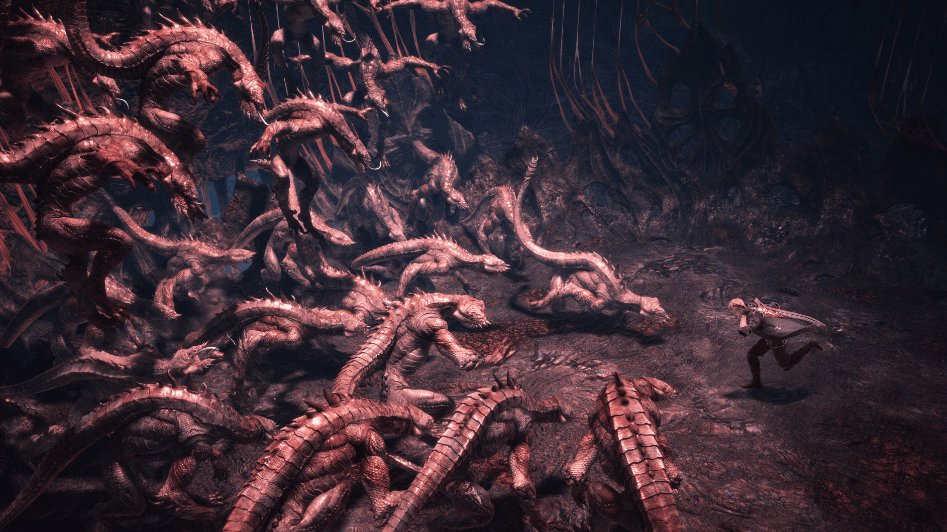 Scena samotnej postaci uciekającej przed wieloma groteskowymi stworzeniami w mrocznym, jaskiniowym otoczeniu.