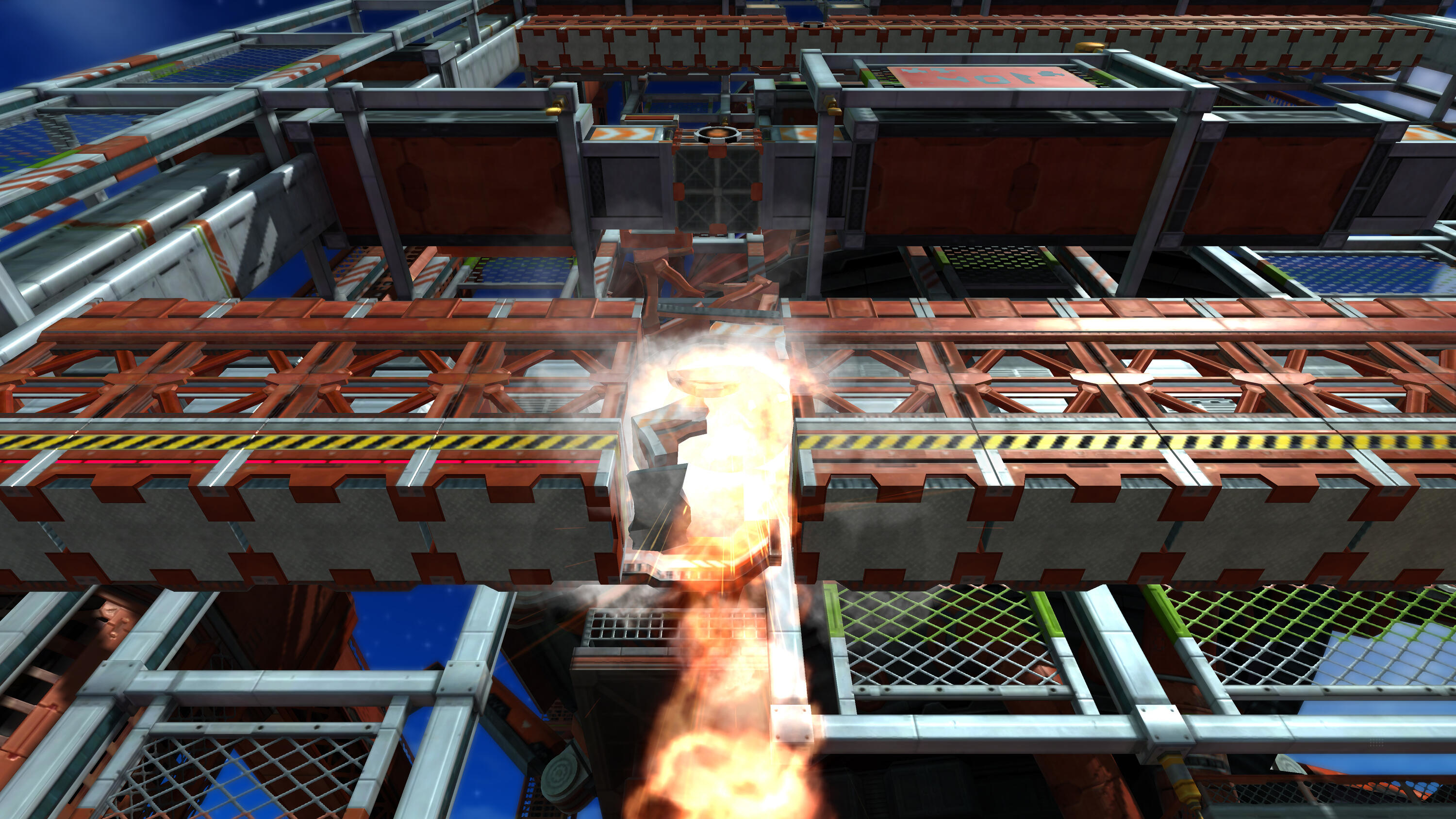 Scena del gioco di Sonic. Una struttura è in fiamme. La scena è ambientata contro un cielo blu. La struttura è metallica.