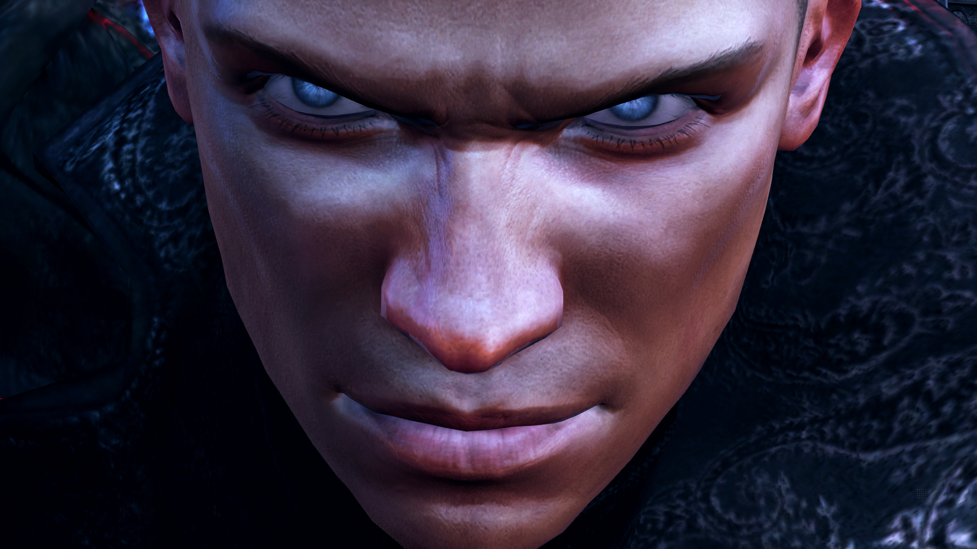 Zbliżenie twarzy mężczyzny, z intensywnymi oczami patrzącymi prosto na widza. Mężczyzna ma zdecydowany wyraz twarzy.