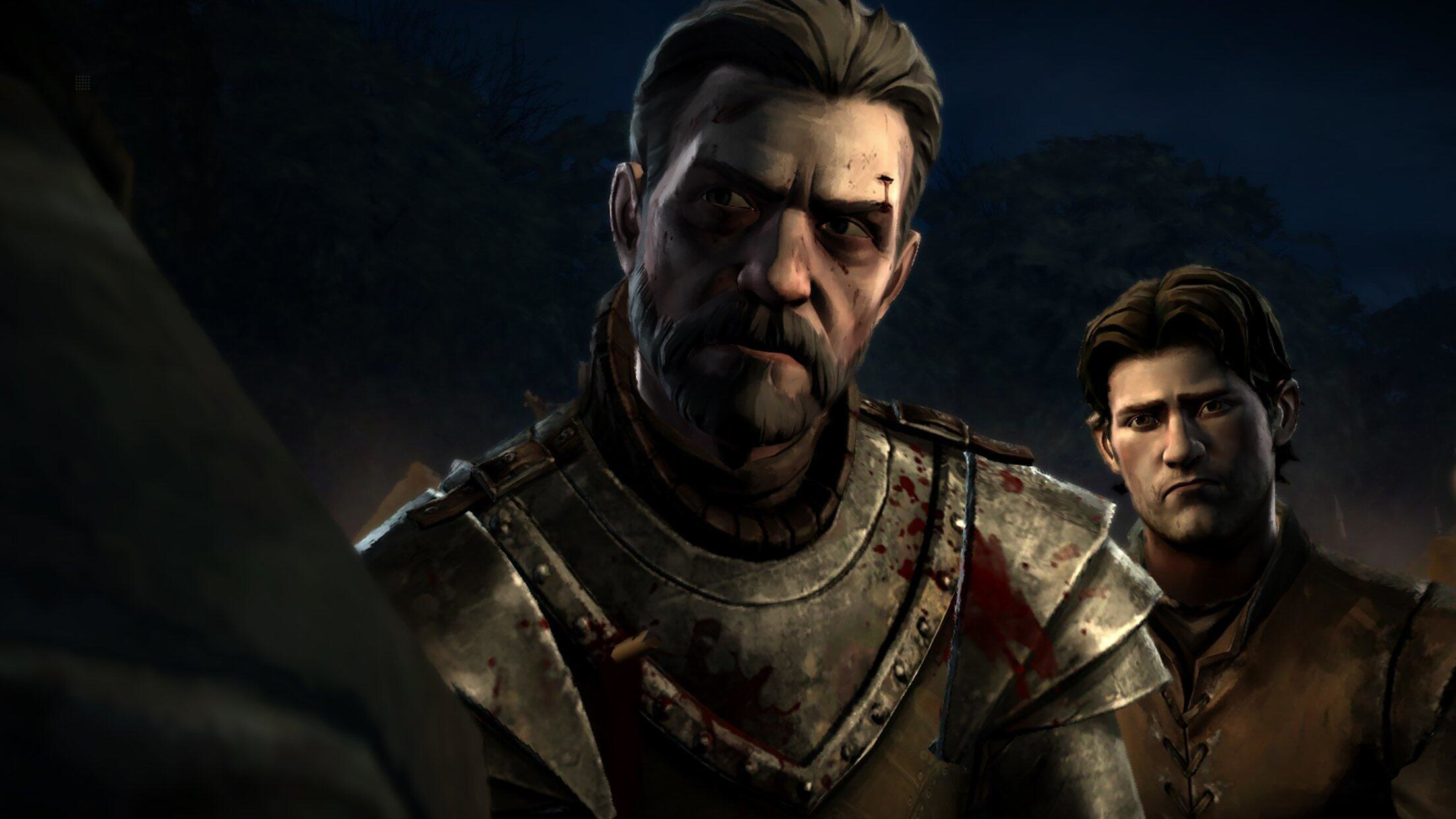 Una scena di Game of Thrones. Due uomini stanno guardando qualcosa. Uno indossa un'armatura e ha sangue.