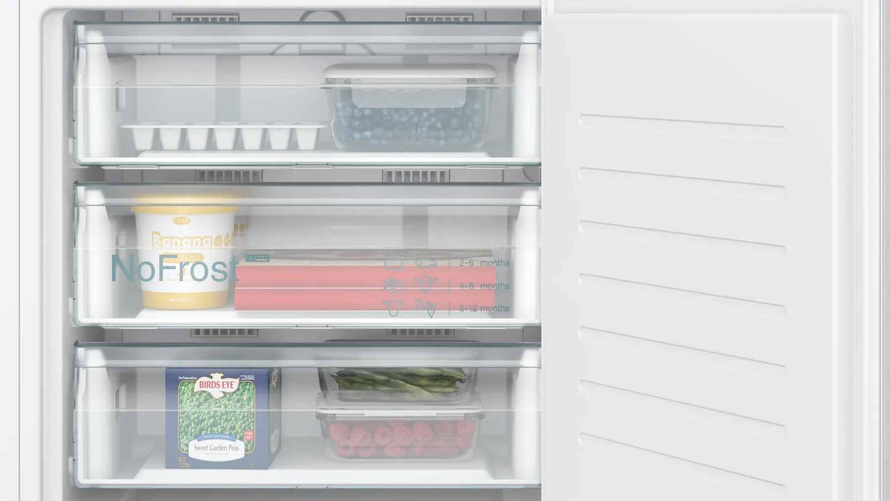 Close-up of refrigerator freezer drawers with various food items: blueberries, ice cream, and vegetables.