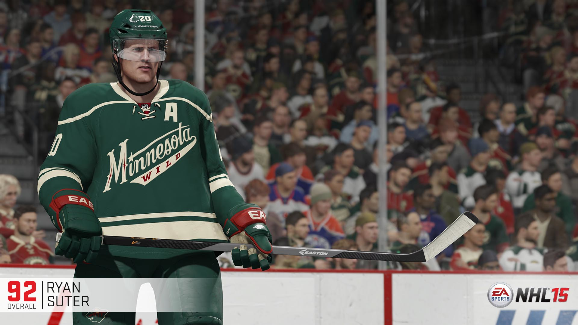 Hockeyspielszene: Spieler in grünem Trikot, Blick zum Betrachter, mit Hockeyschläger.