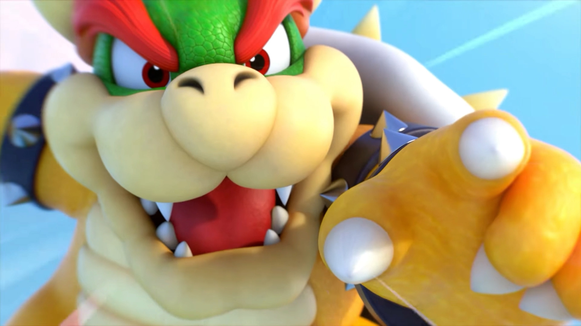 Primo piano del volto di Bowser, che mostra i denti, con una mano chiusa in primo piano.