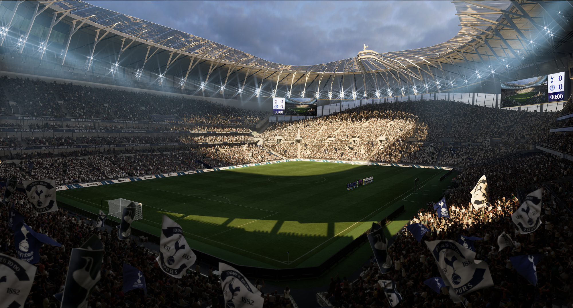 Uno stadio pieno di persone, con un campo di calcio e luci brillanti.