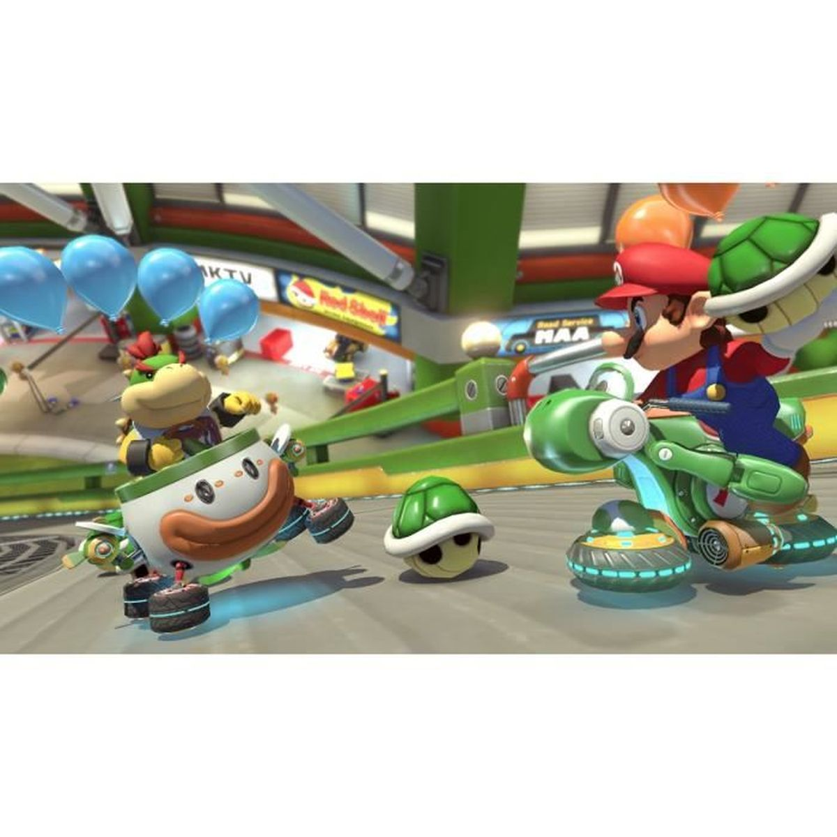 Scena z gry Mario Kart z Bowserem i Mario. Ścigają się gokartami w kolorowym otoczeniu.