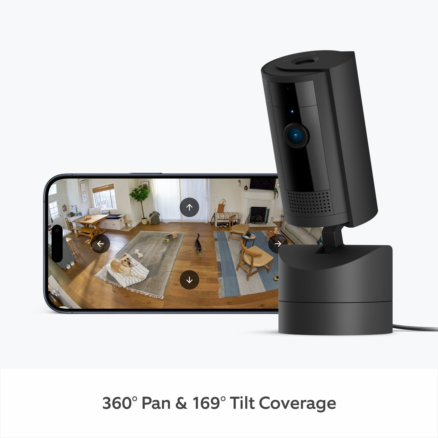 Una cámara de seguridad negra junto a un teléfono que muestra una vista de la habitación.