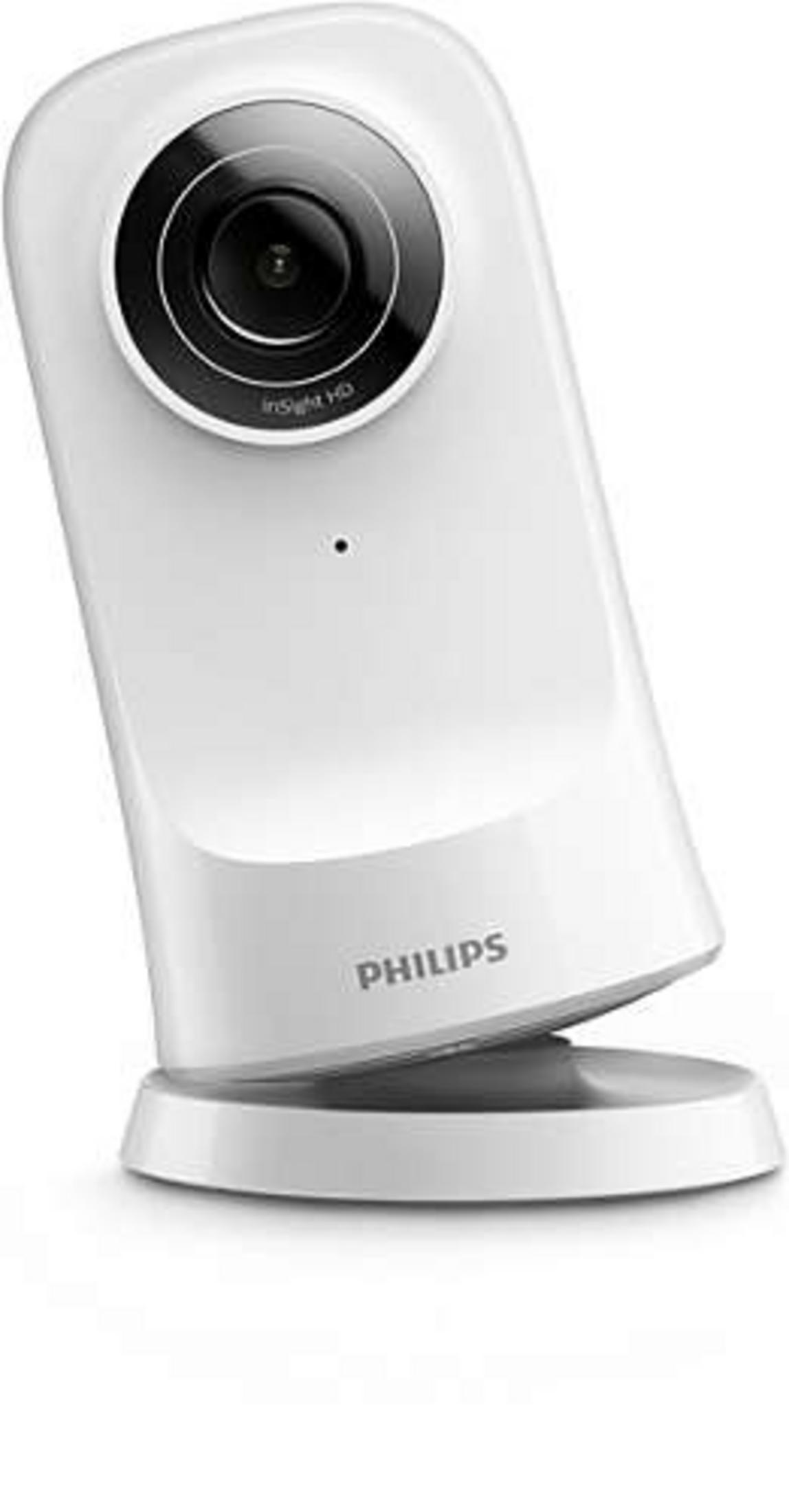 White Philips baby monitor with a rounded base and a black lens.