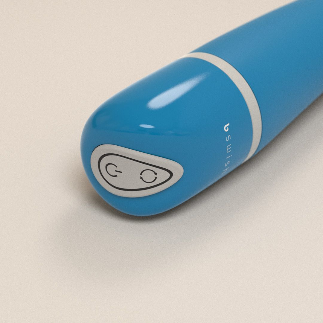 Primer plano del botón de un vibrador azul con iconos de encendido y ciclo.