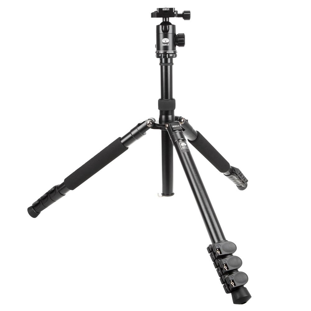 A black tripod on a white background. The tripod has adjustable legs and a head.